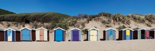 Beach huts along the sand