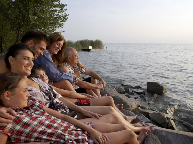 Family sat by the sea