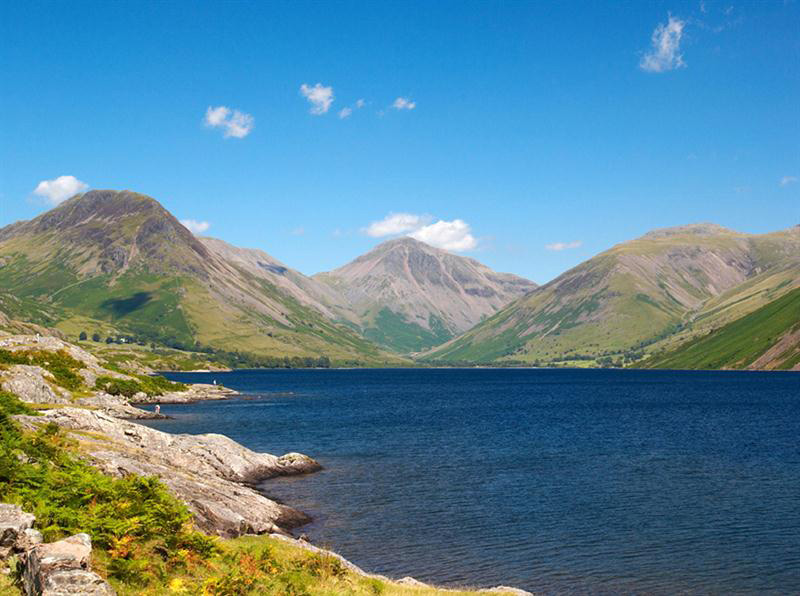 View of a lake with hills/mountains surrounding it