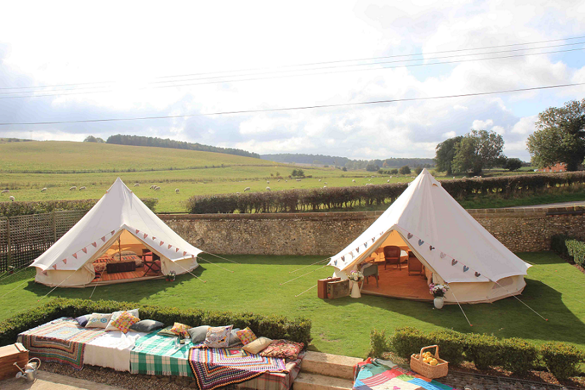 Large luxury tents with views of the countryside