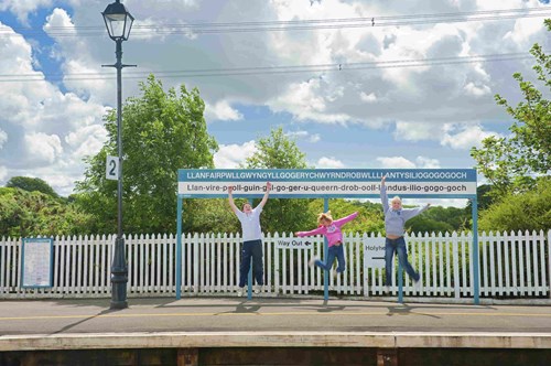 Children celebrating on a railway station