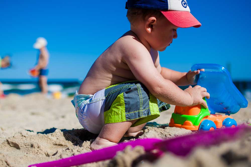 Child playing in the sand