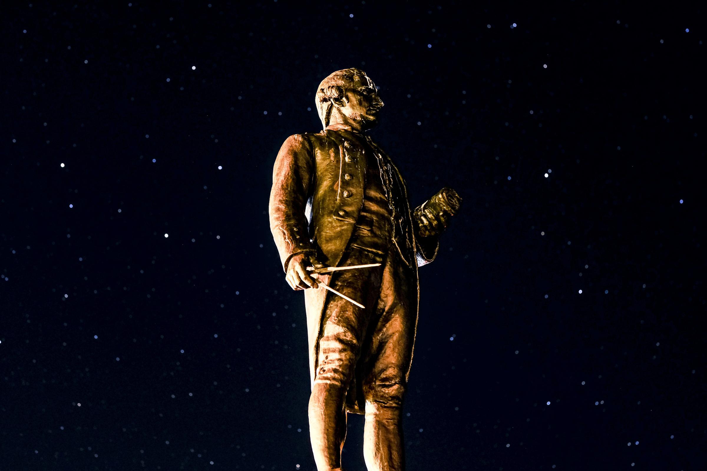 A starry sky behind the Captain Cook monument on the West Cliff at Whitby