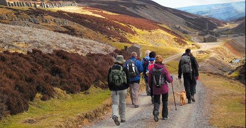 Group of people walking through the Yorkshire Dales National Park