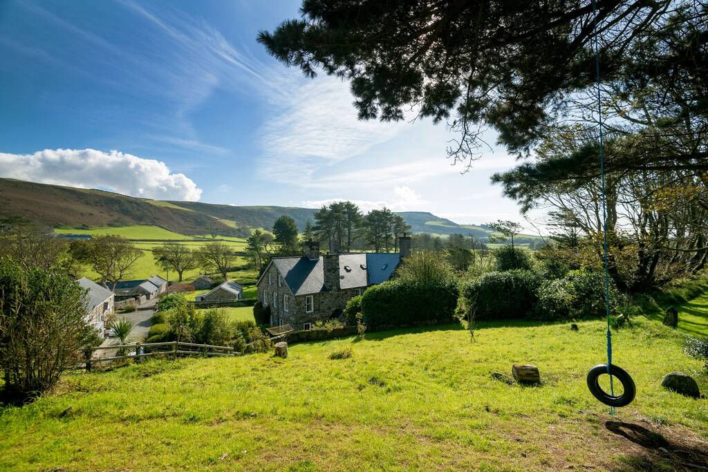 Exterior shot of a luxury holiday cottage surrounded by fields 