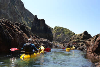 People kayaking in Cornwall