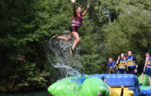 People jumping into the river in Dorset