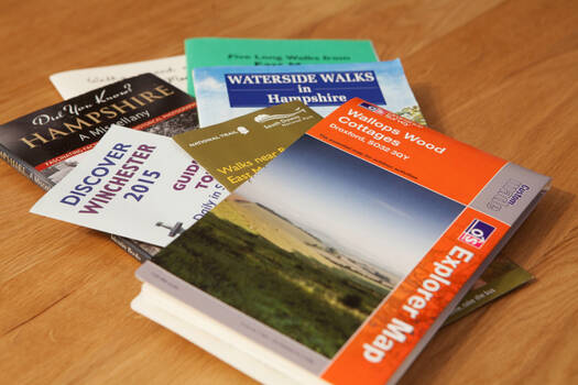 Books and guides on a wooden table