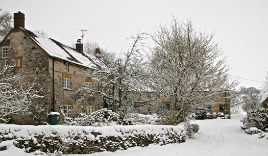 Holiday cottage covered in white snow