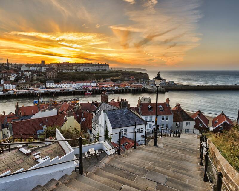 Steps down to Whitby seaside at sunset