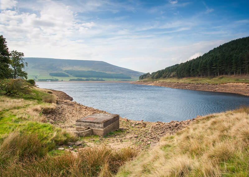 Views of a lake surrounded by hills