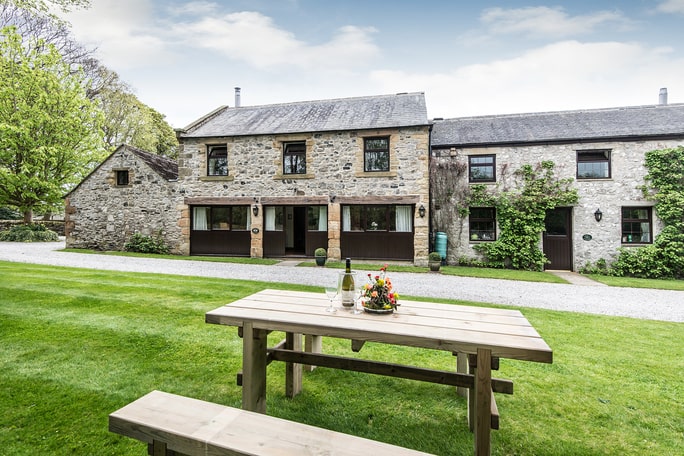 Table on the grass outside a holiday cottage