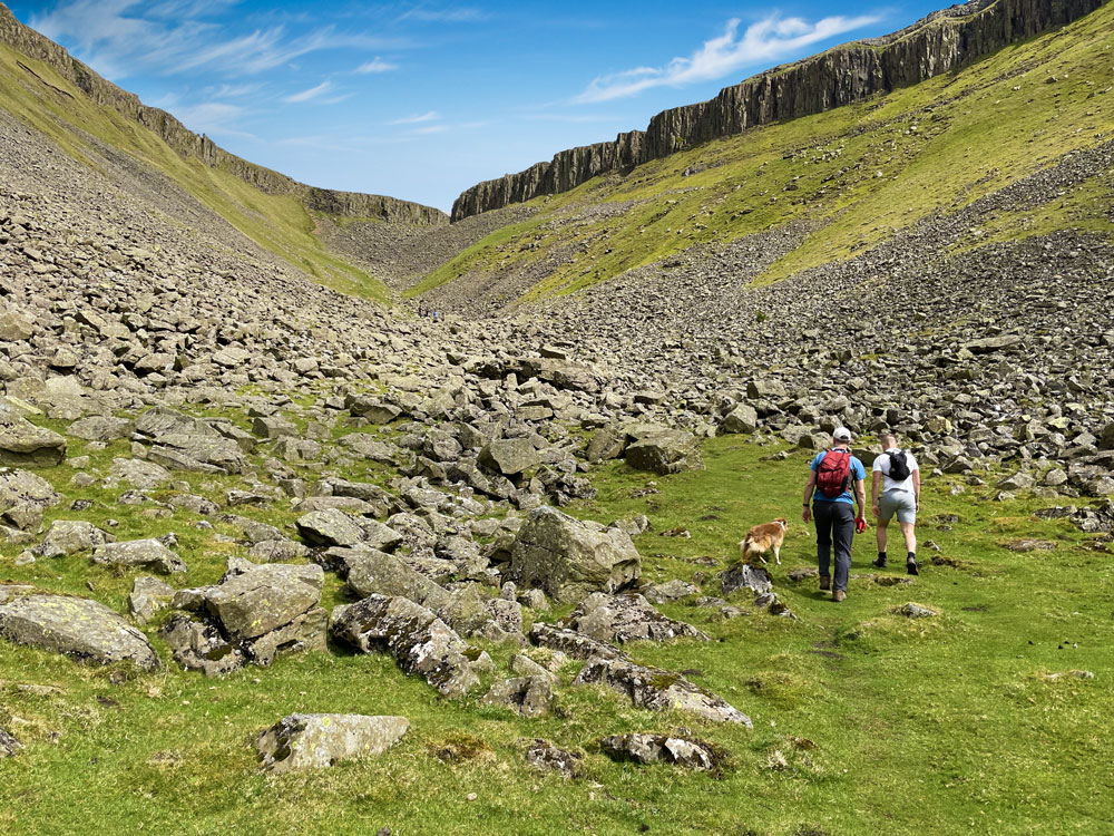 A couple walking along High Cup Nick