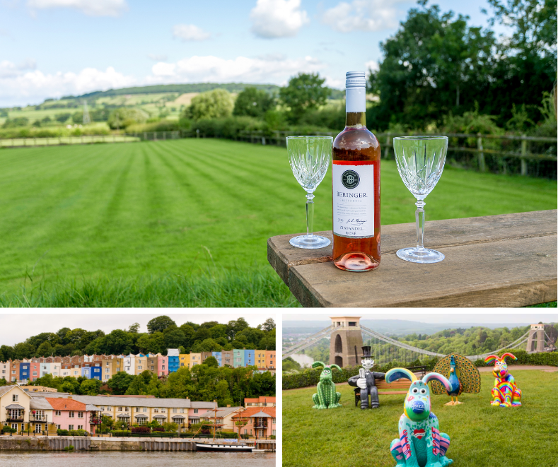 Peaceful countryside scene with wine and glasses overlooking rolling hills, colourful harbourside houses, and vibrant character sculptures near the Clifton Suspension Bridge.