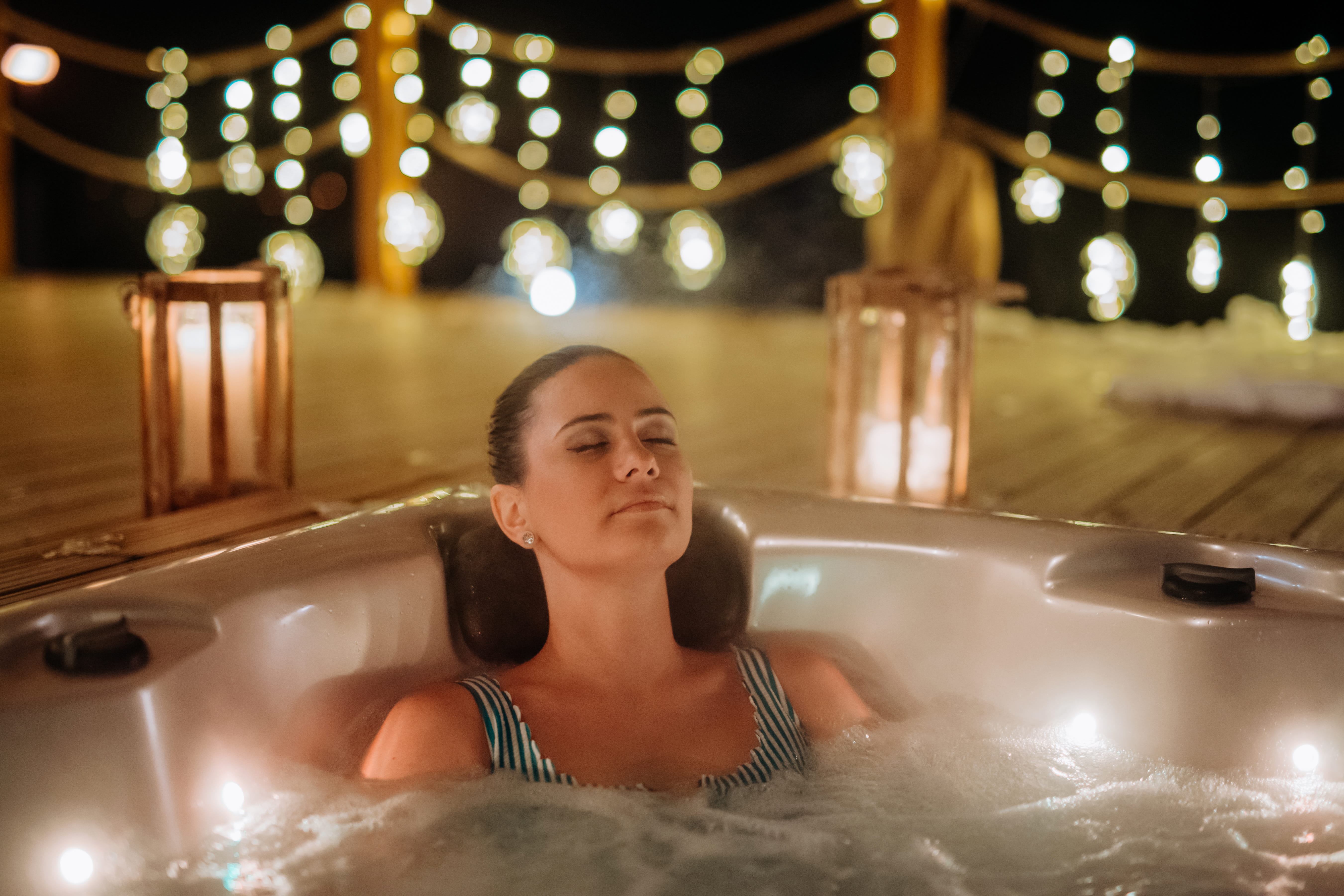 Woman relaxing in hot tub