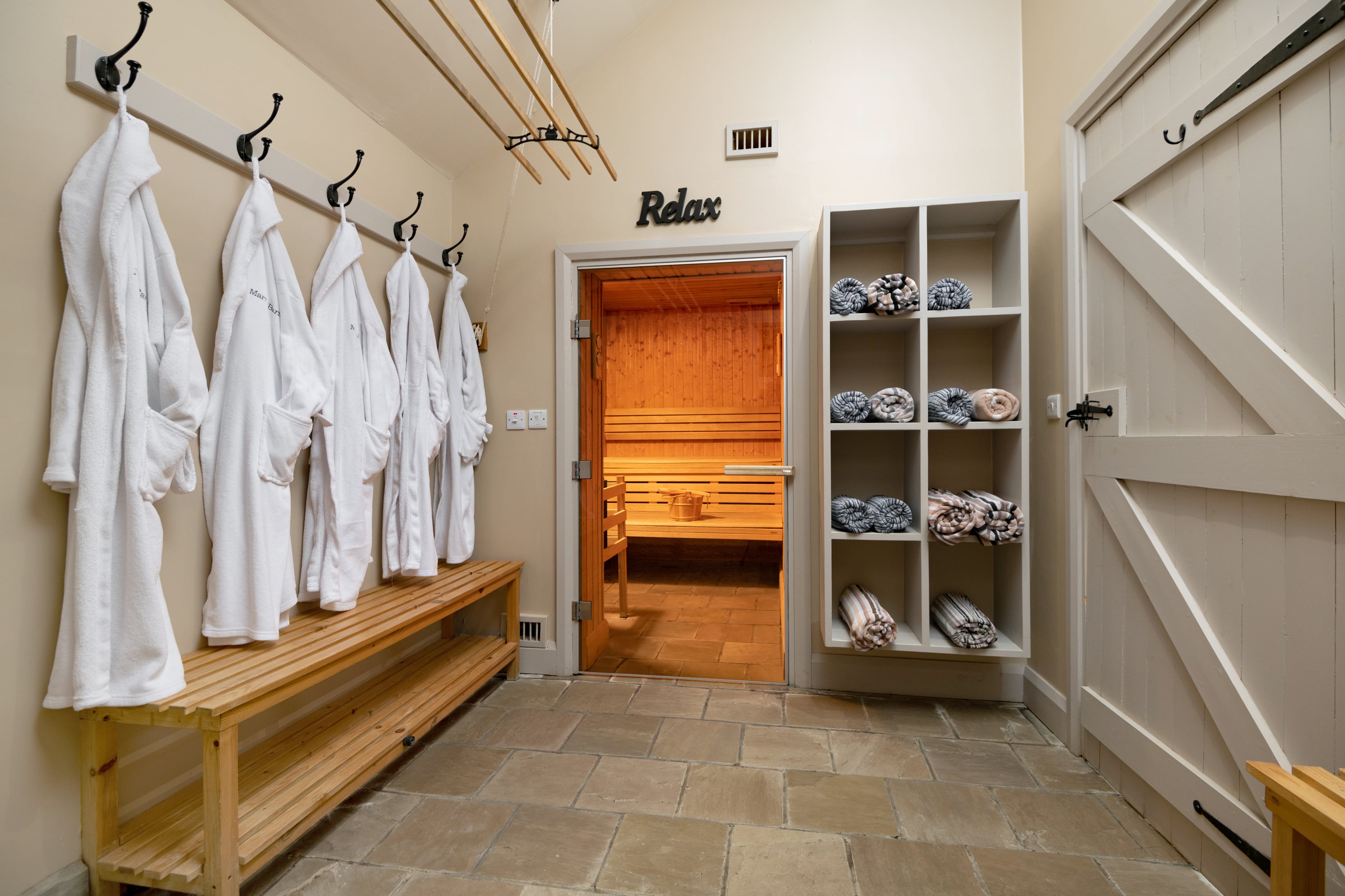 Robes hanging by sauna