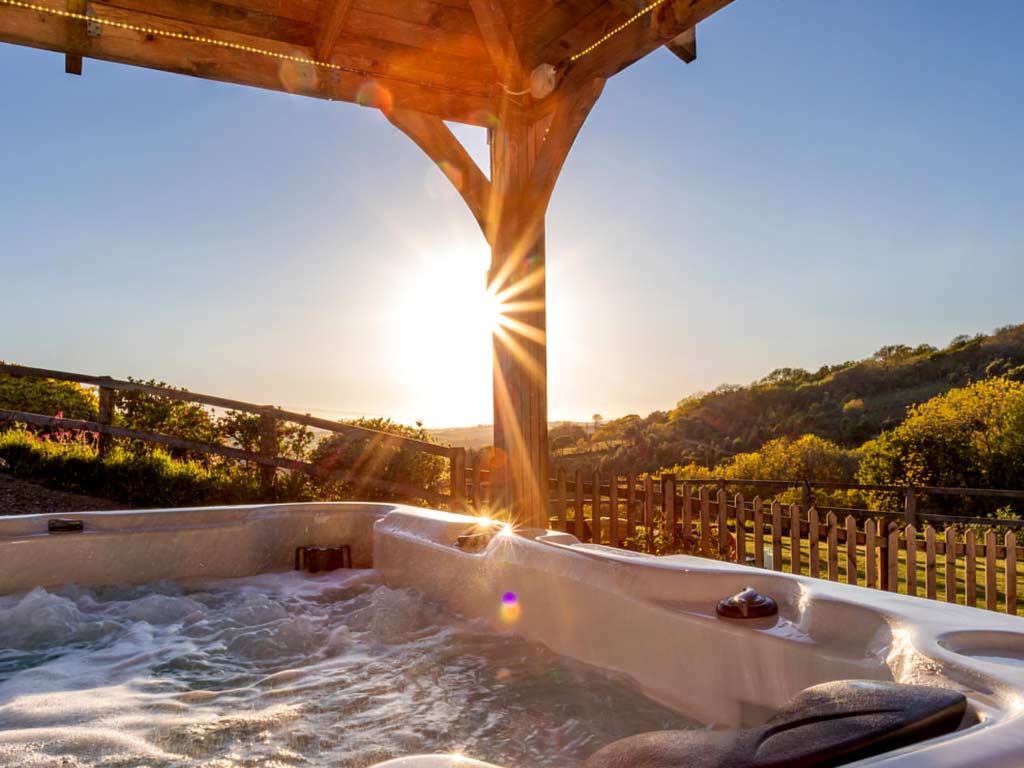 hot tub with a view over rolling countryside